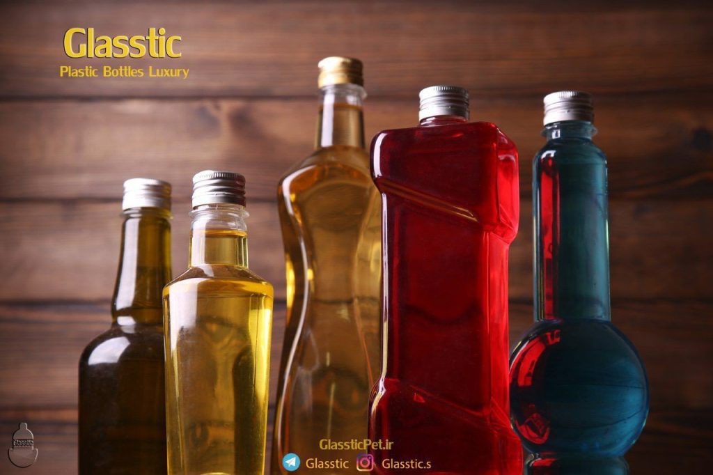 چندین بطری پت رنگی با طراحی متنوع و درب فلزی، مناسب برای صنایع غذایی و نوشیدنی